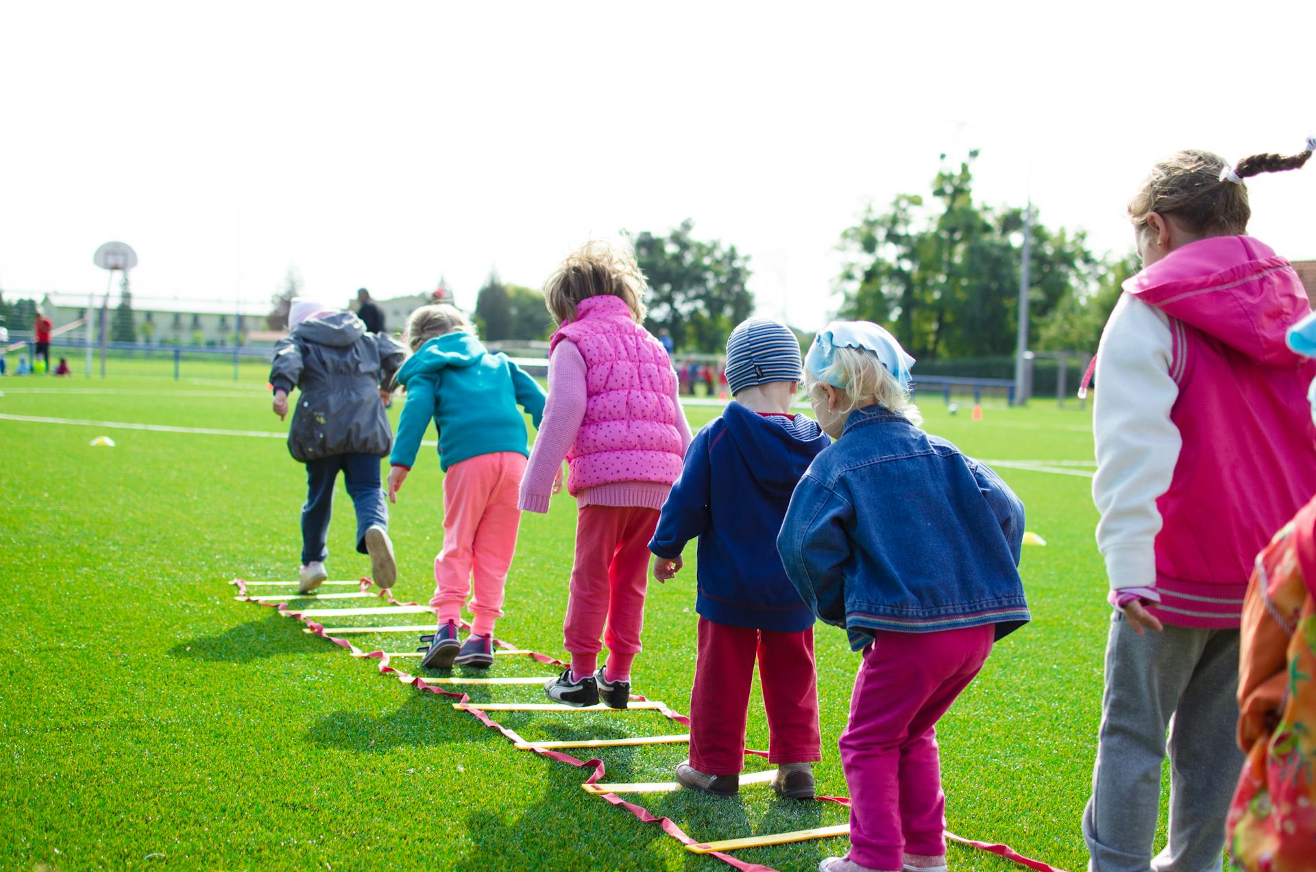 Cheerful little children playing with each other | Source: Pexels