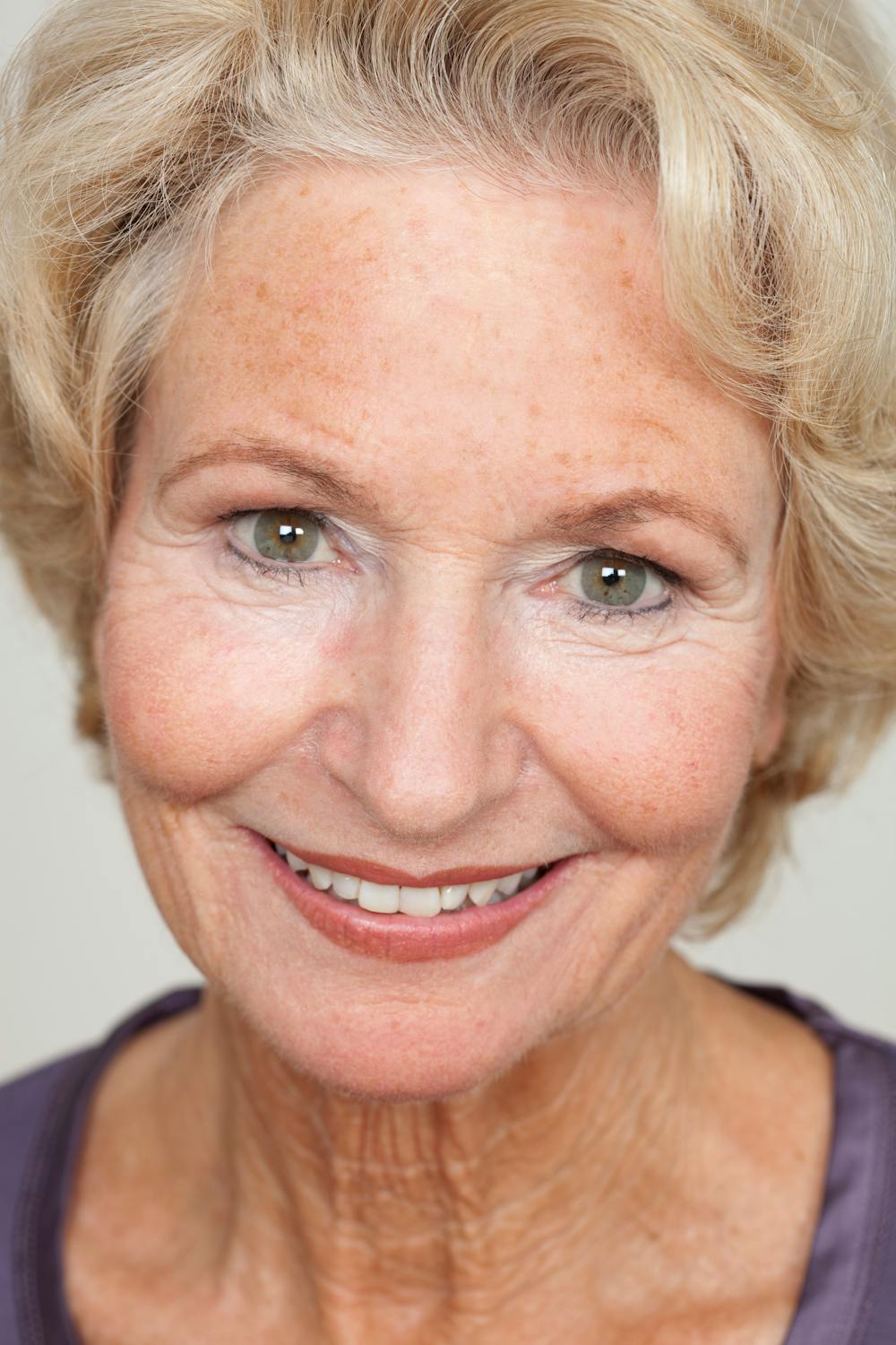 A smiling elderly woman | Source: Pexels
