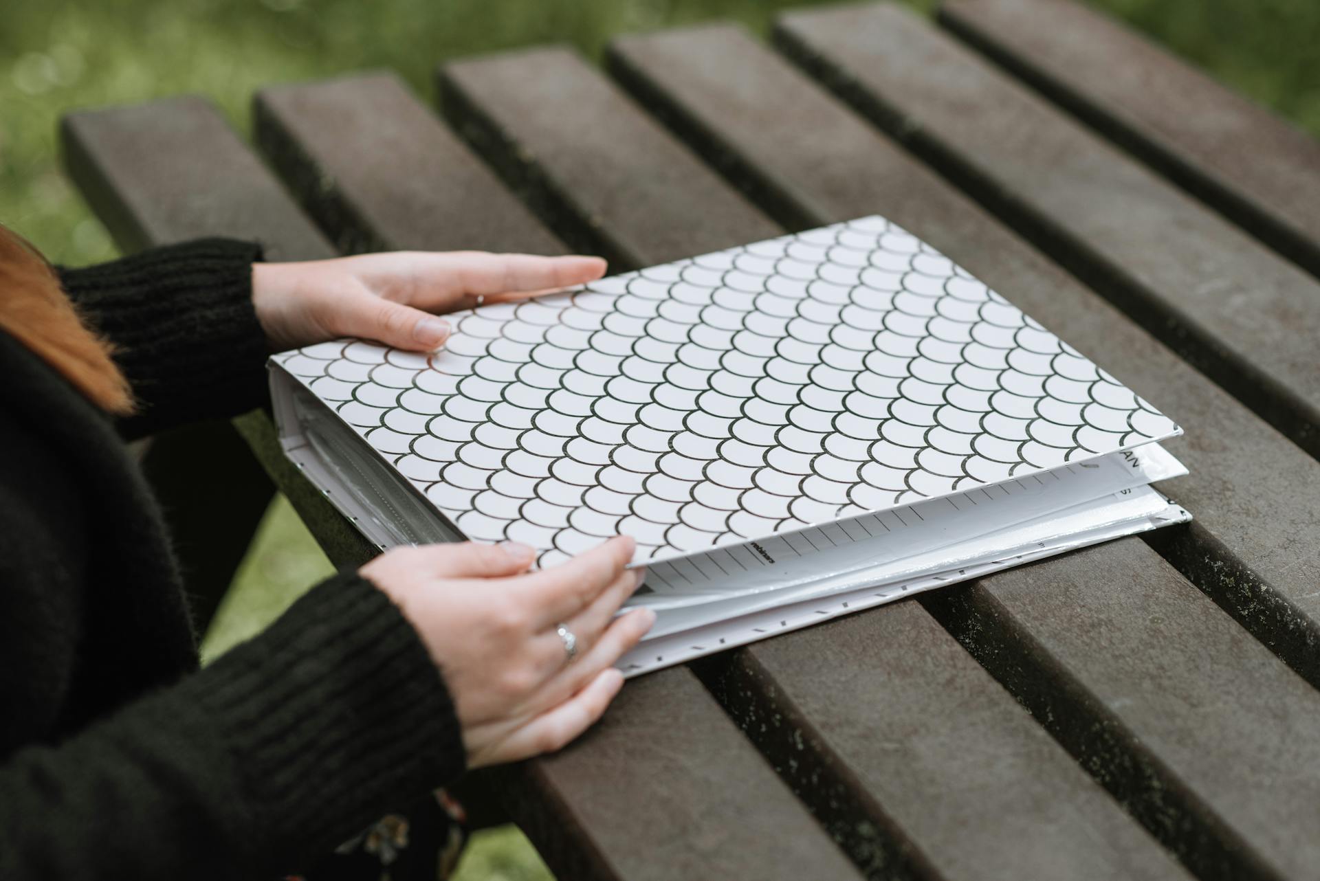 A woman holding a folder | Source: Pexels