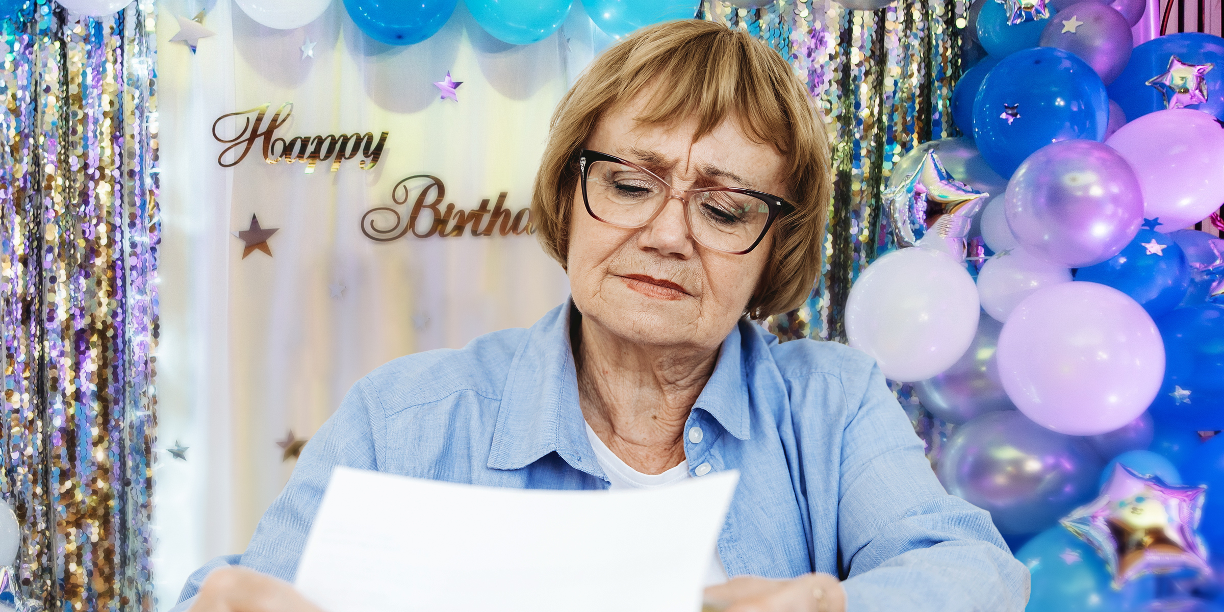 A woman holding a piece of paper at a birthday party | Source: Shutterstock