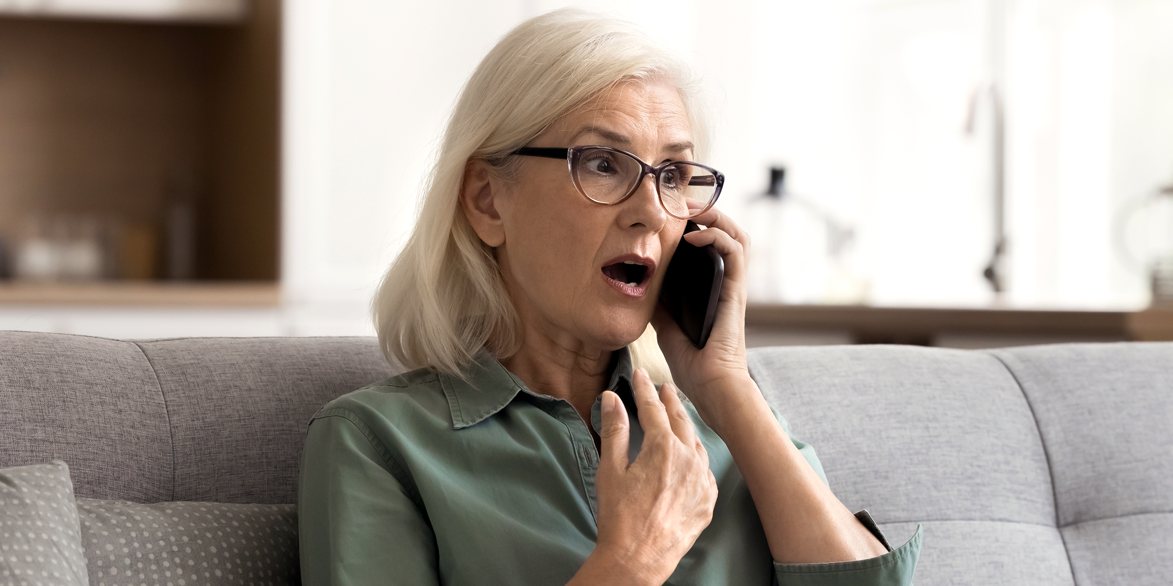 An older woman talking on the phone | Source: Shutterstock