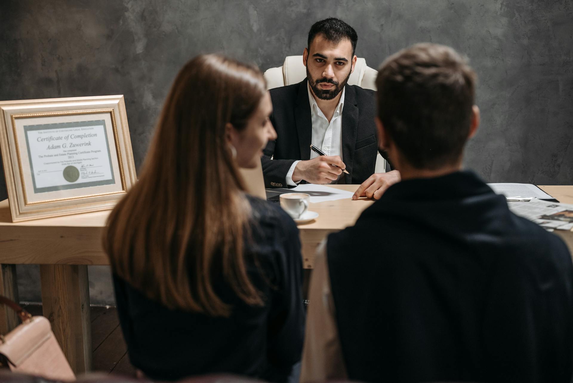 A couple seated in a lawyer's office | Source: Pexels