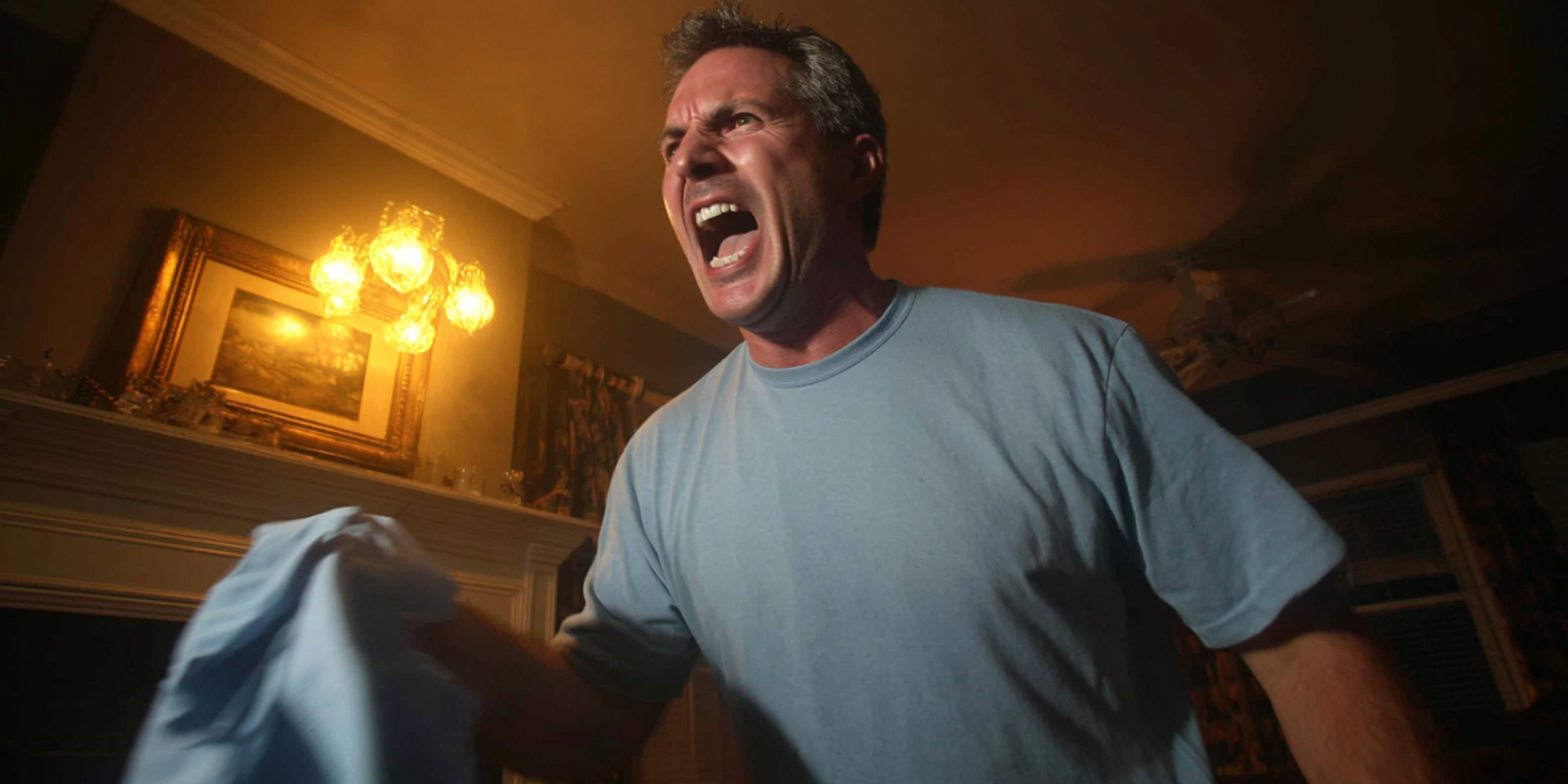 A man yelling at someone while holding a shirt | Source: The Celebritist