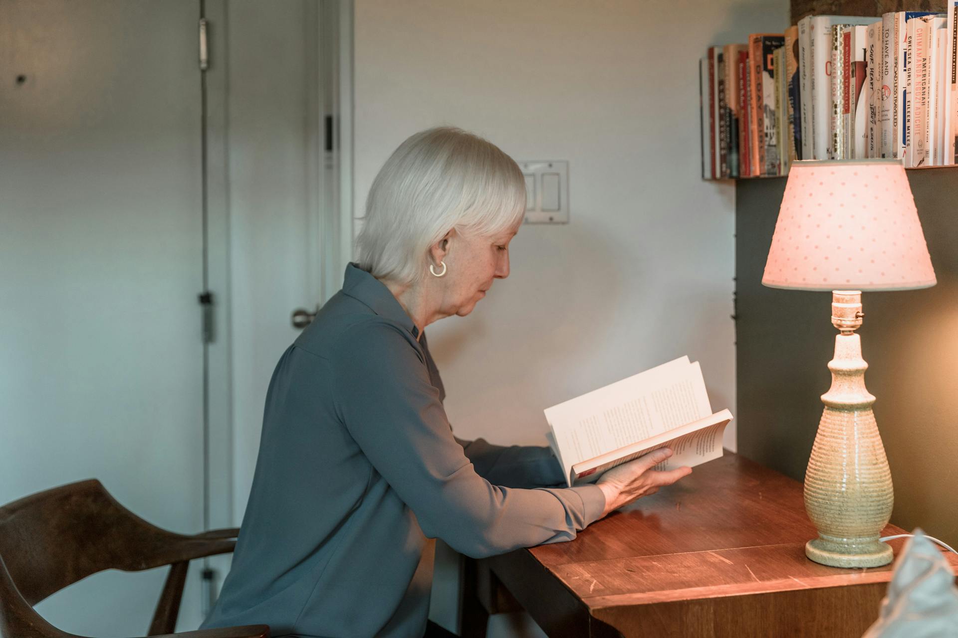 A senior woman reading a book | Source: Pexels