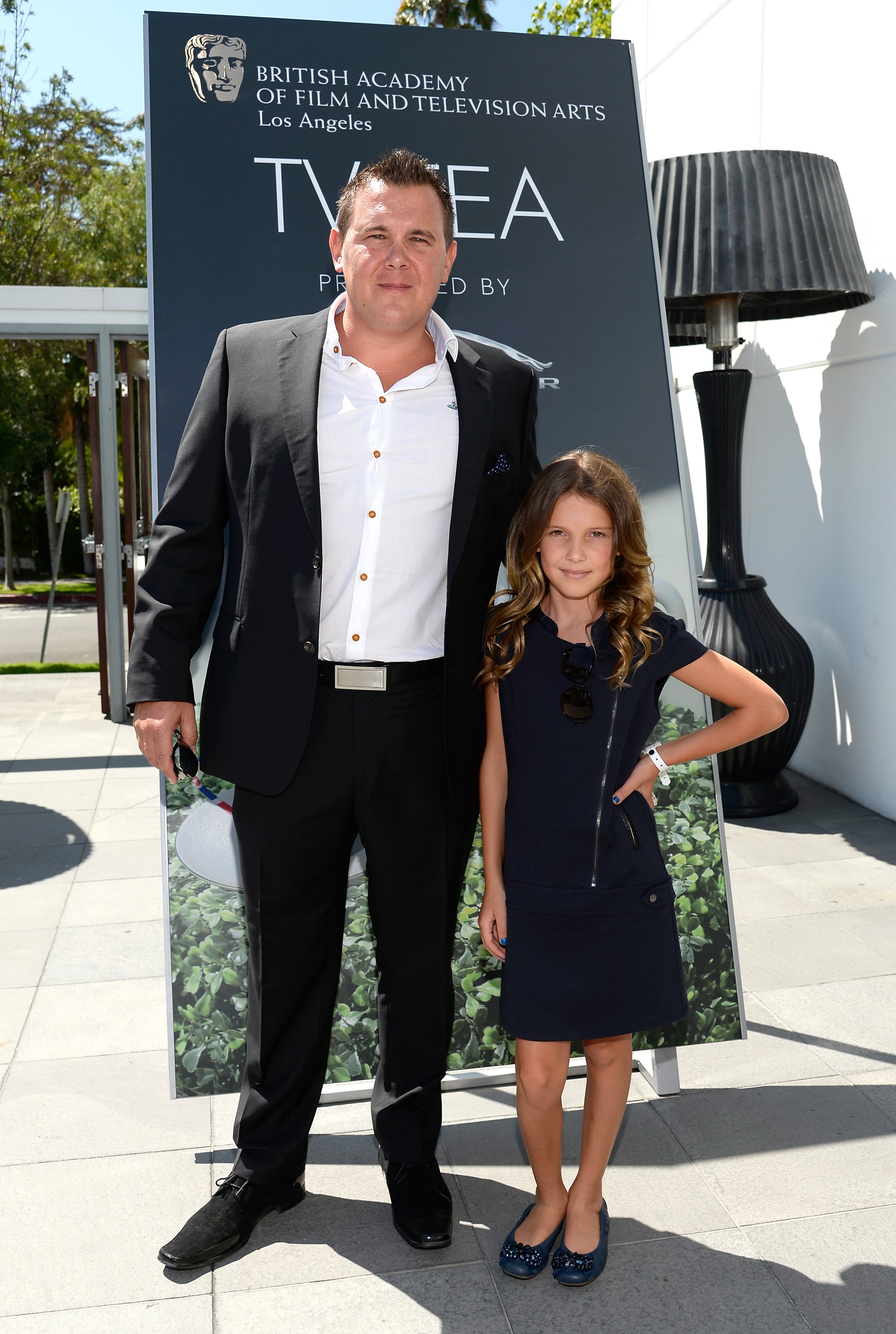Robert Brown and Millie Bobby Brown attend the 2014 BAFTA Los Angeles TV Tea at SLS Hotel in Beverly Hills, California on August 23, 2014 | Source: Getty Images