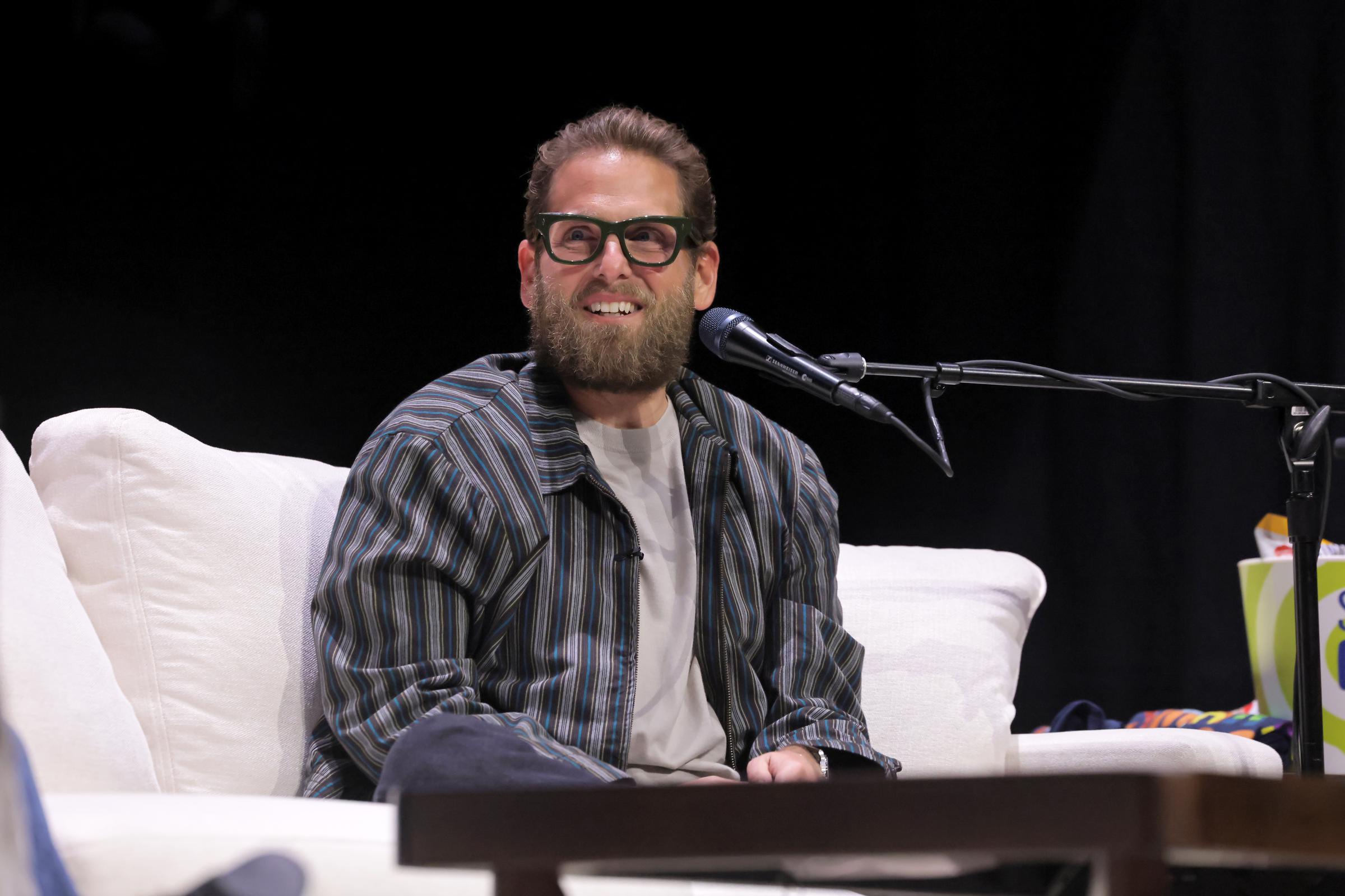 Jonah Hill speaks onstage during SiriusXM Presents SmartLess LIVE at Avalon Hollywood on April 25, 2026 in Los Angeles, California. | Source: Getty Images
