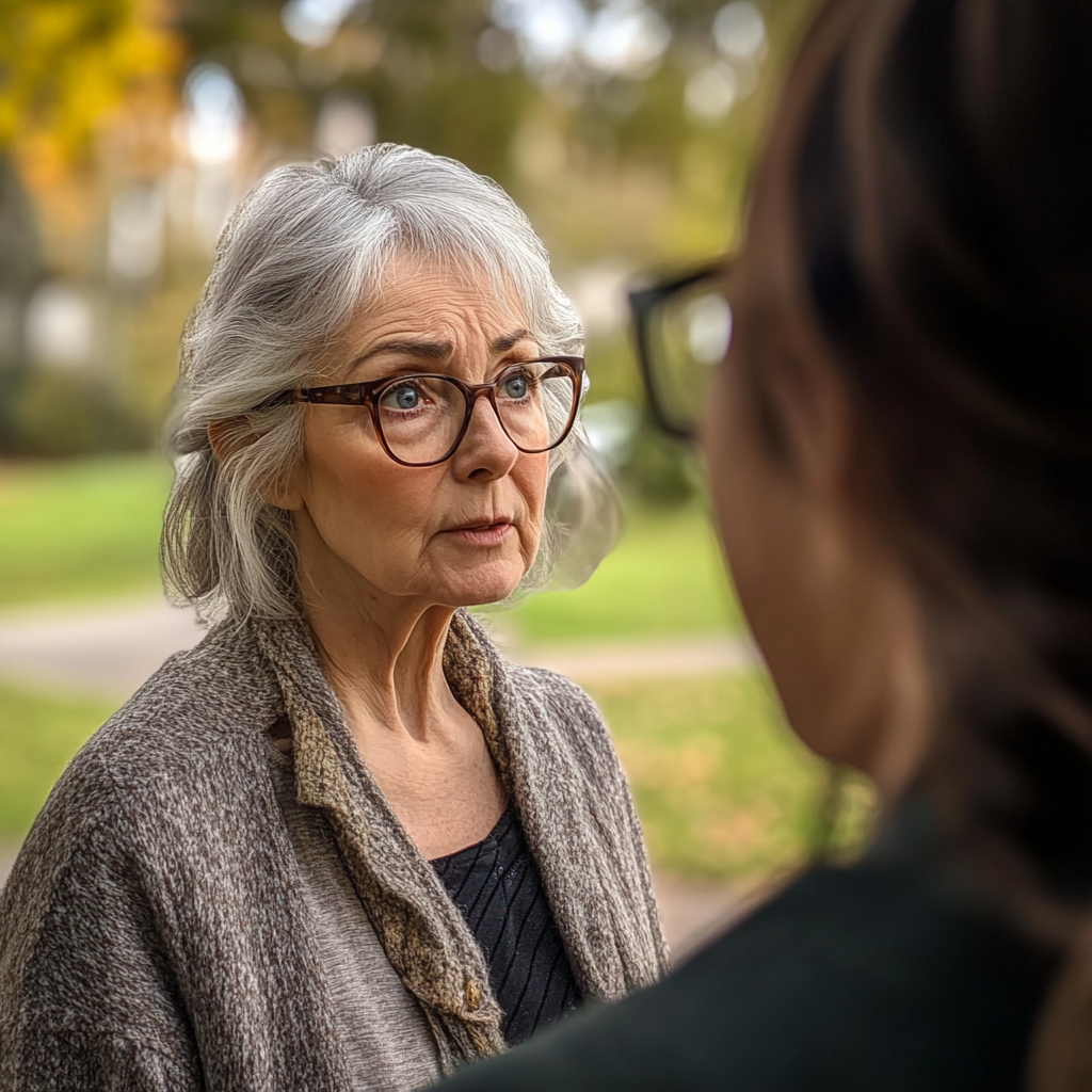 A nervous senior woman speaking to an angry 40-year-old woman | Source: Midjourney