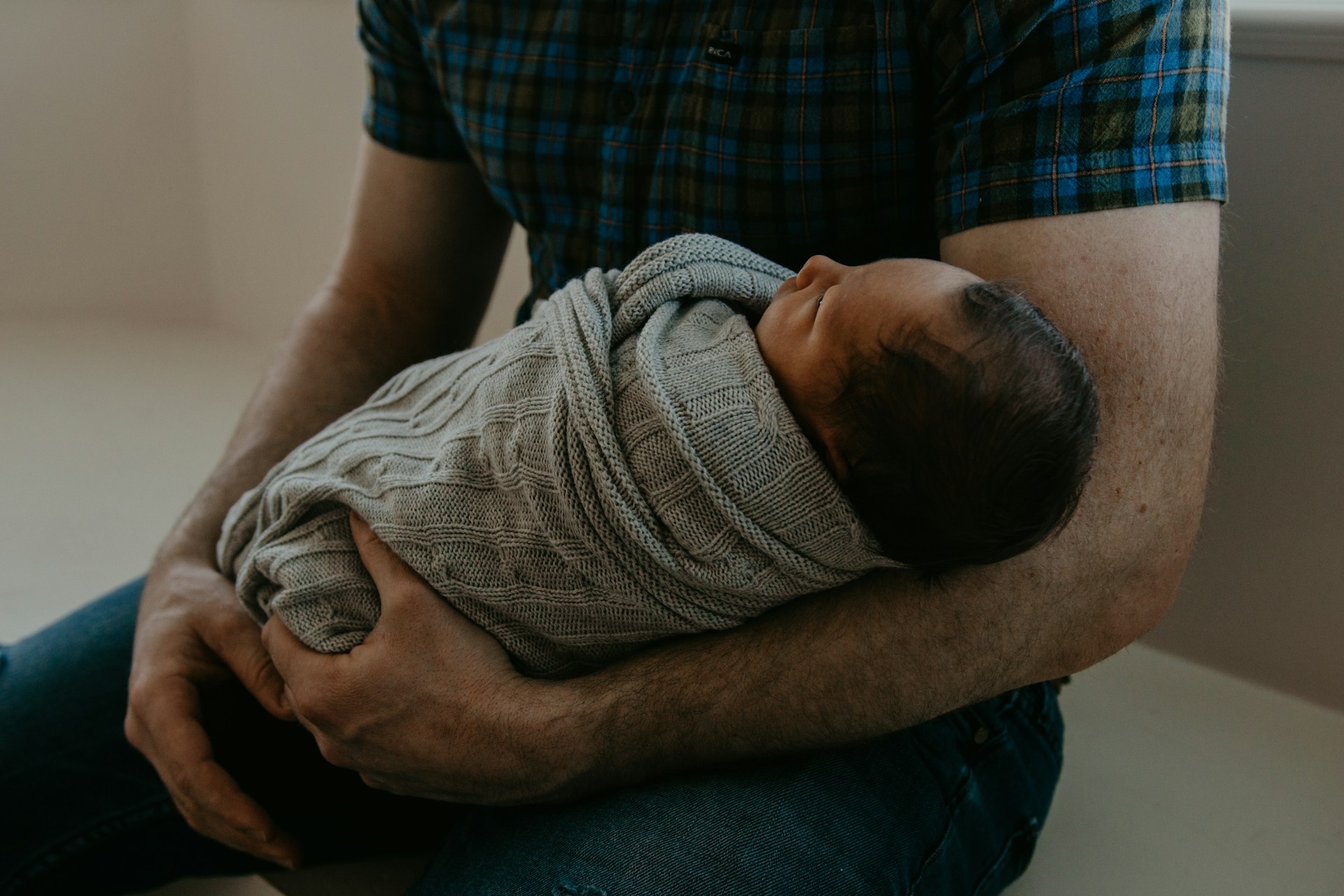 A man holding his baby | Source: Unsplash