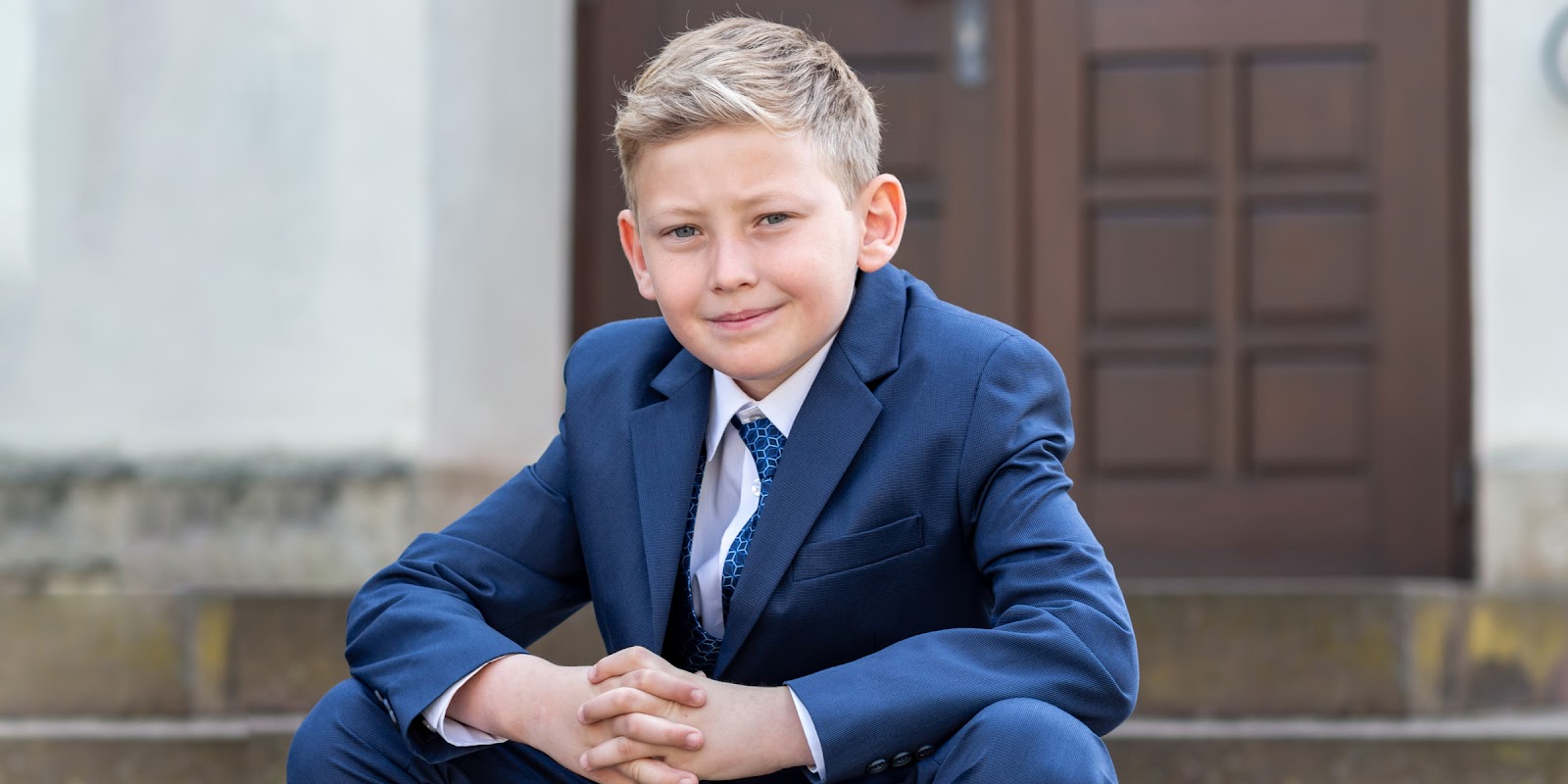 A boy in a suit | Source: Shutterstock