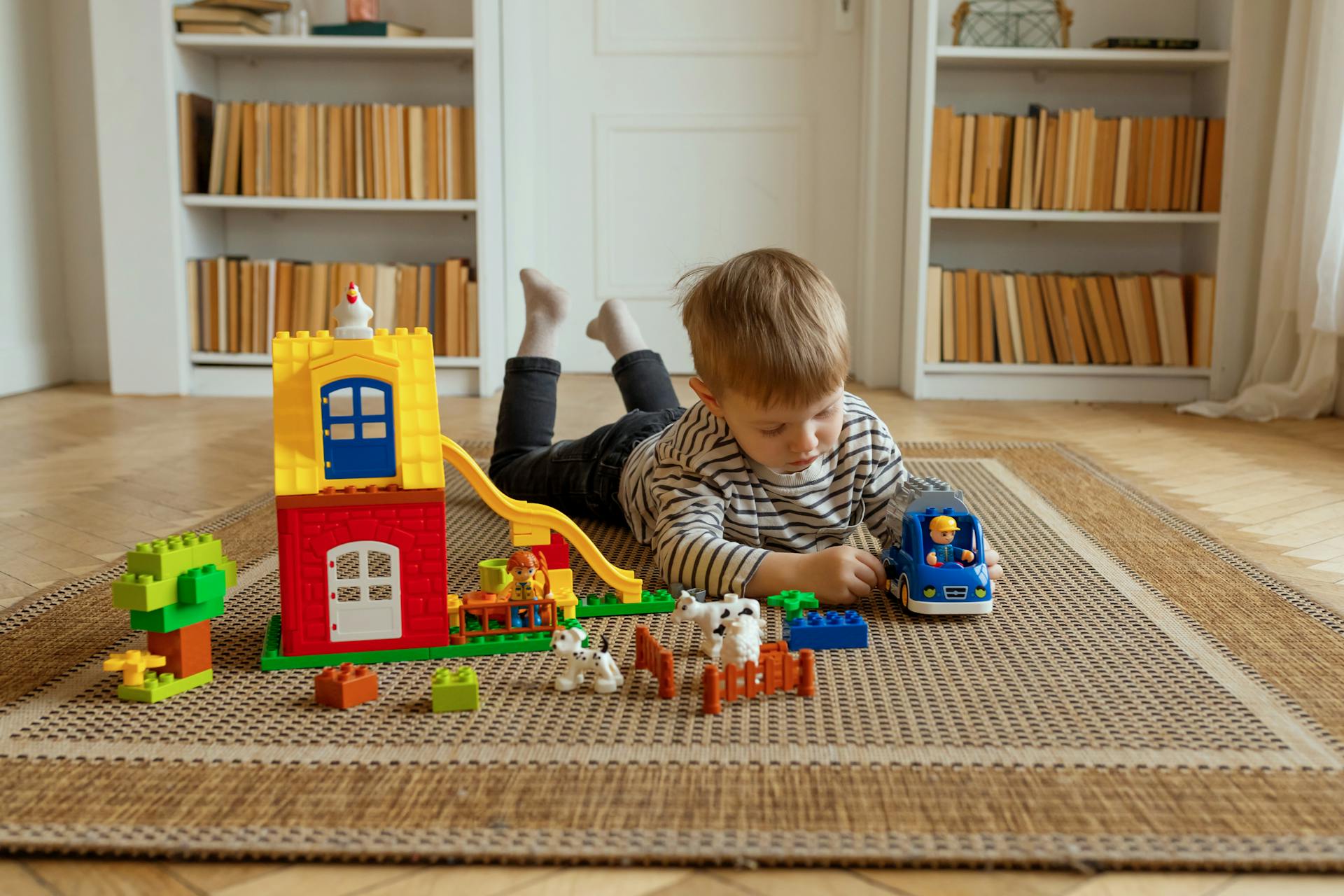 A child playing with his toys | Source: Pexels