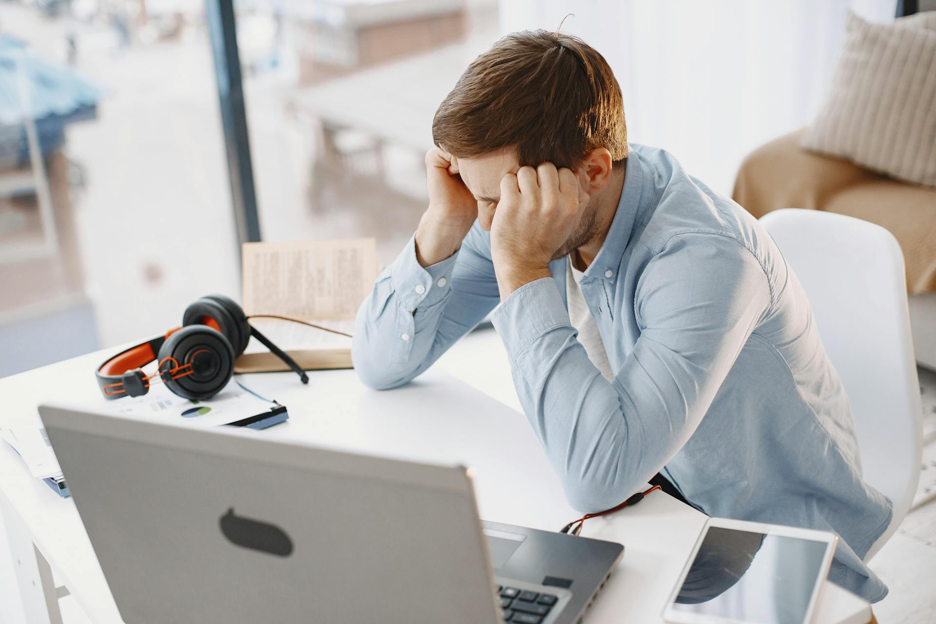 An anxious man sitting in his office | Source: Pexels