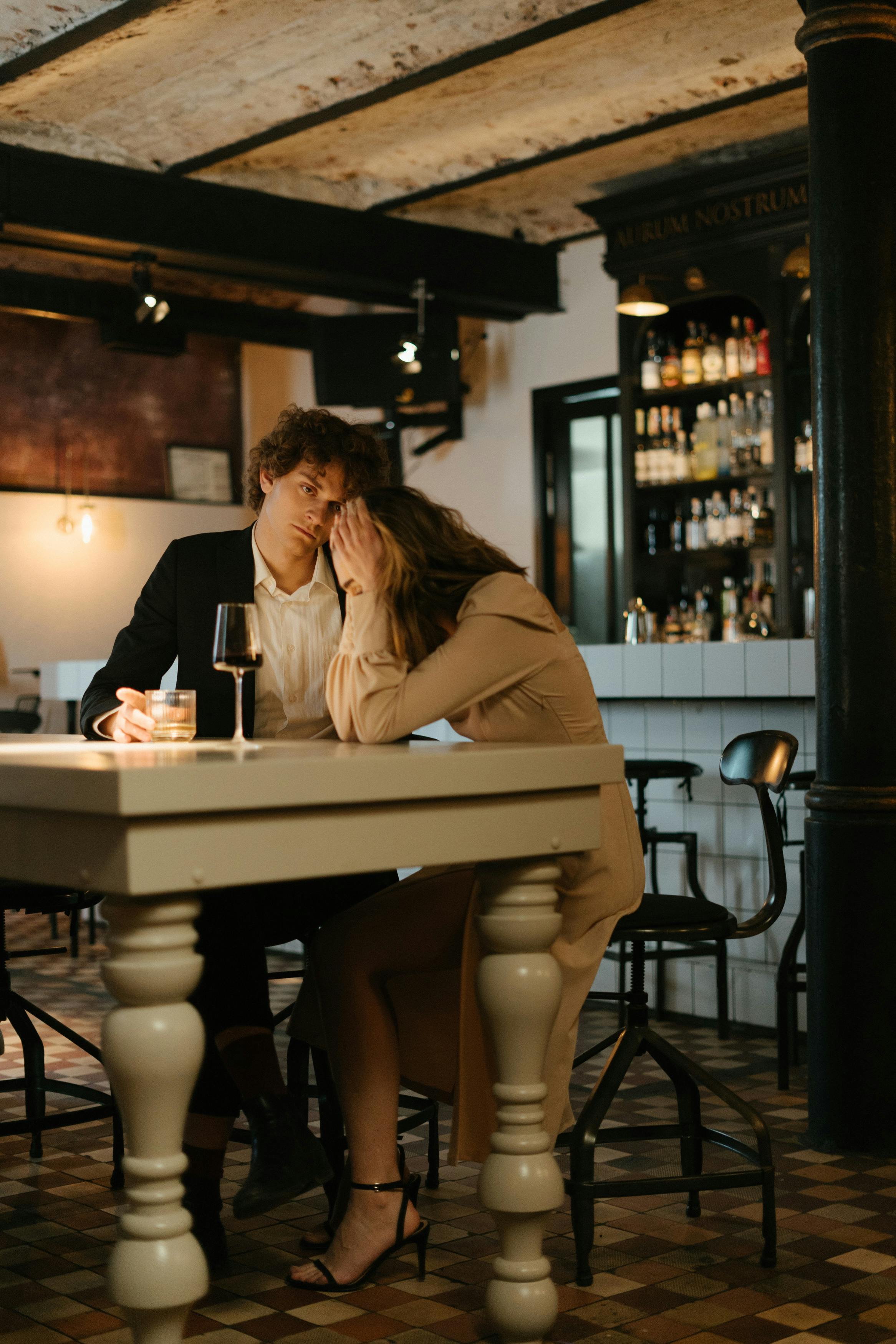 A man looking solemn while a woman looks distressed | Source: Pexels