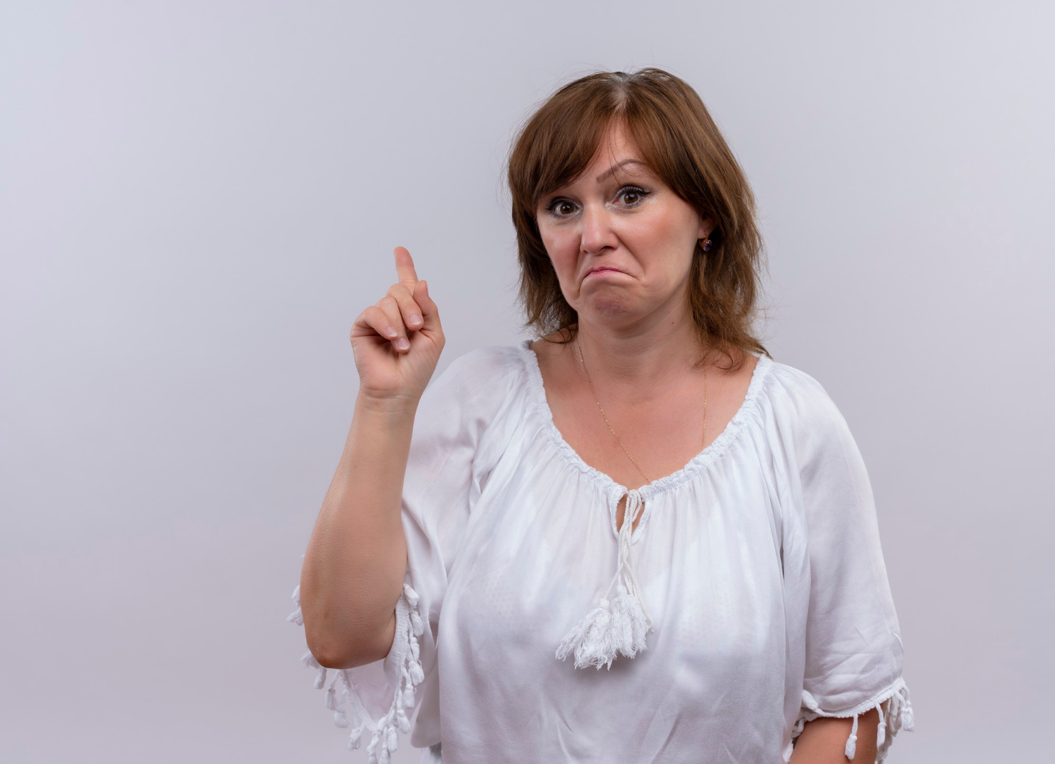 A woman pointing her finger, recalling something | Source: Freepik