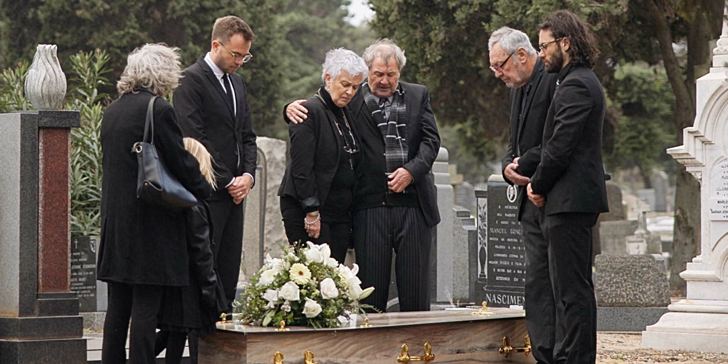 A family at a funeral | Source: Shutterstock