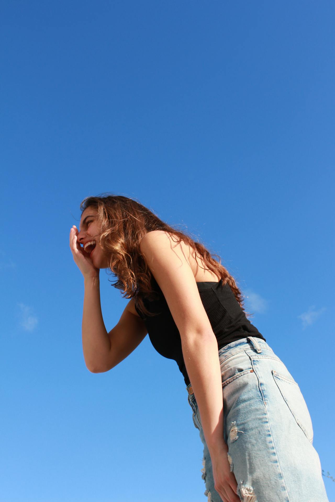 A woman laughing | Source: Pexels