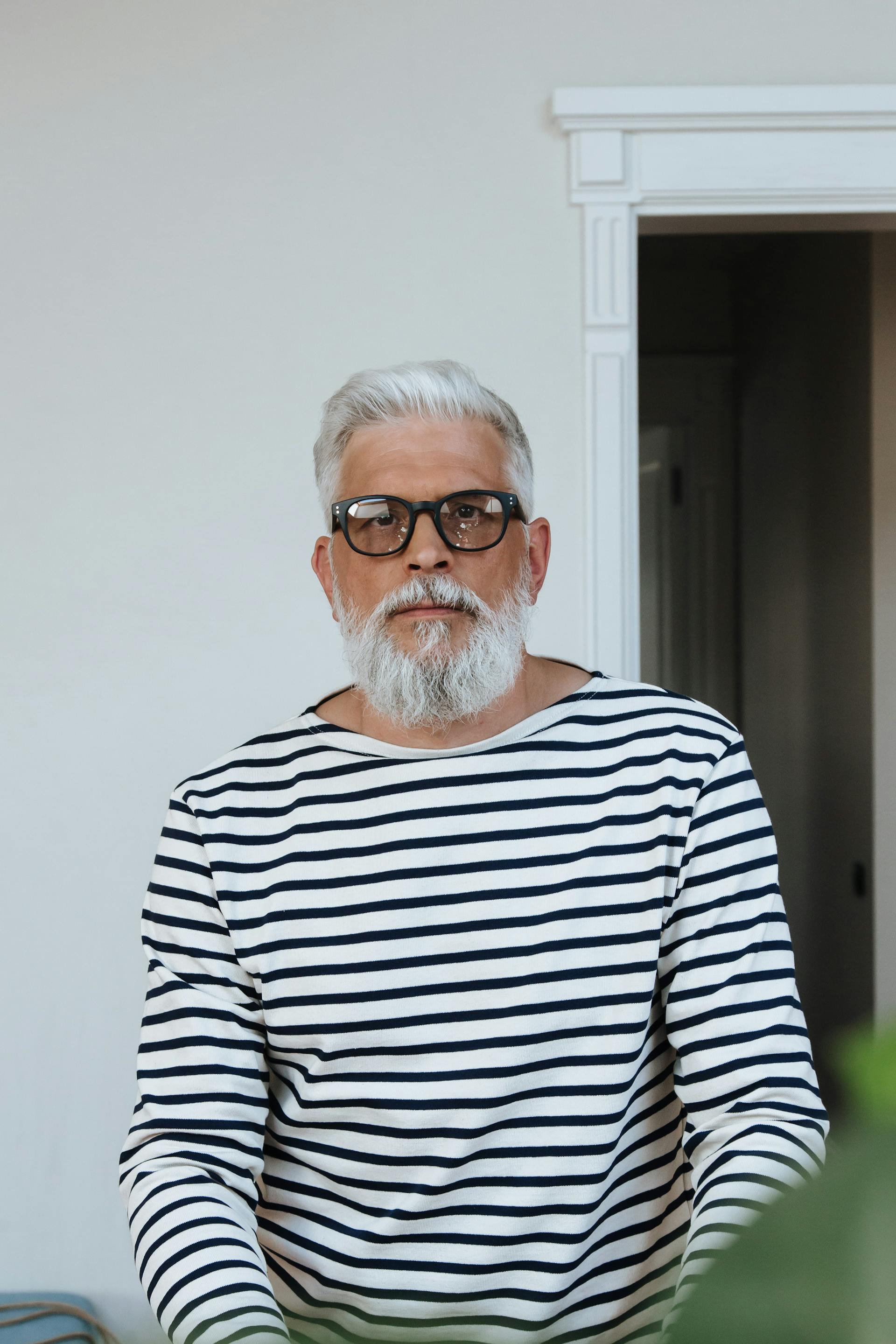 A senior man standing | Source: Pexels