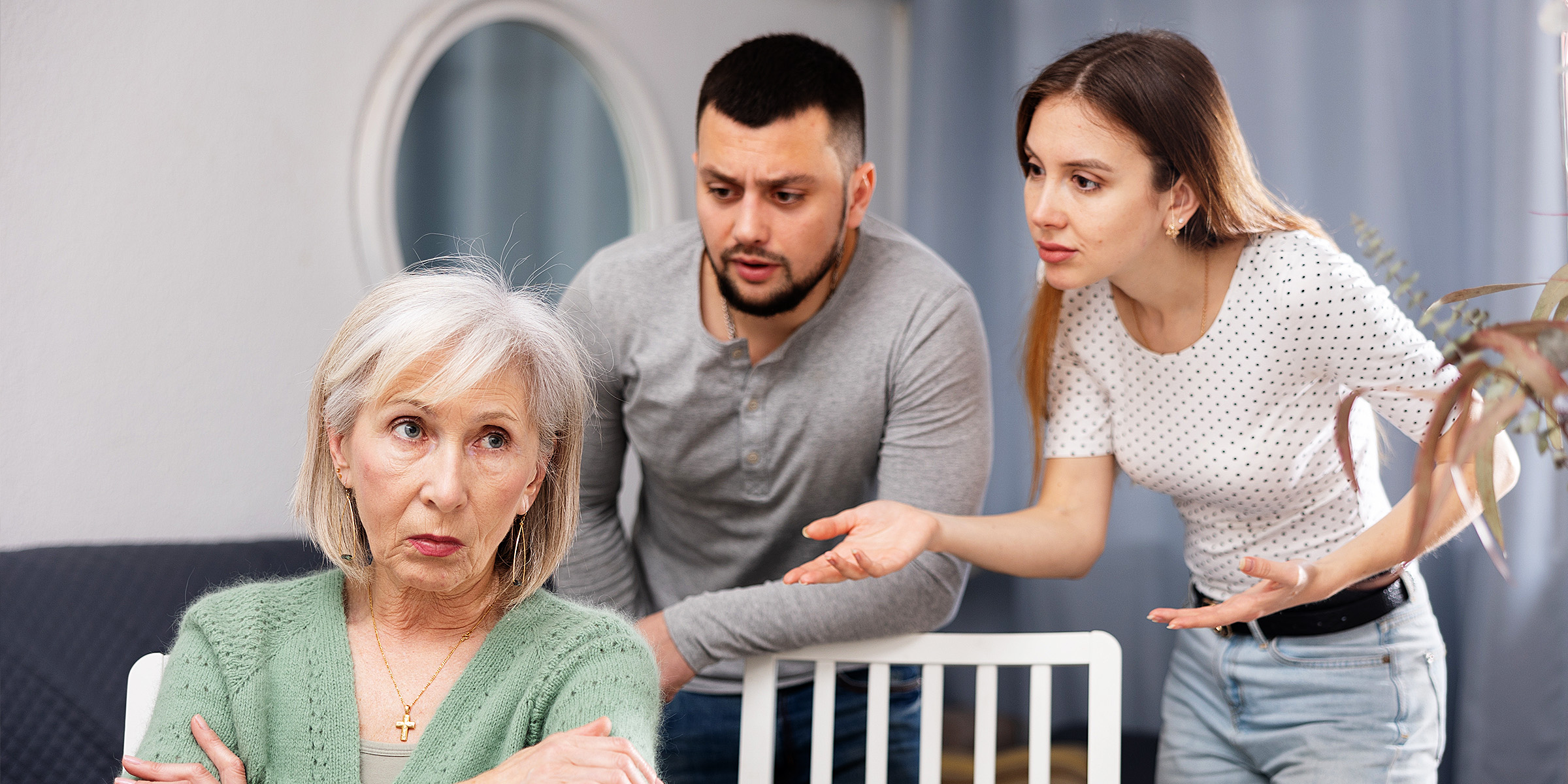 A couple arguing with an older woman | Source: Shutterstock