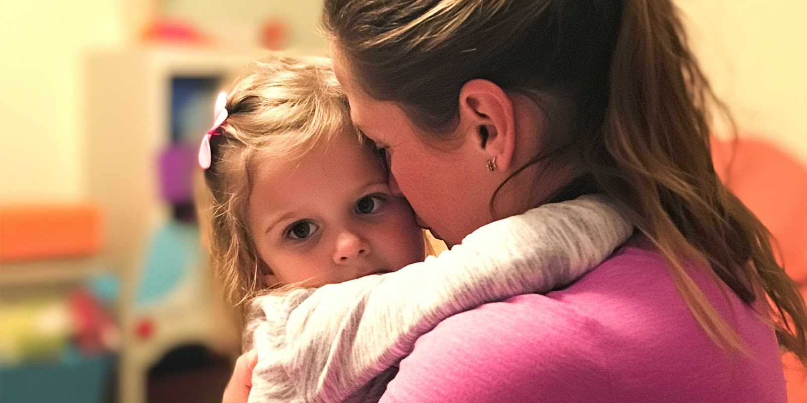 Woman hugs little girl. | Source: Midjourney