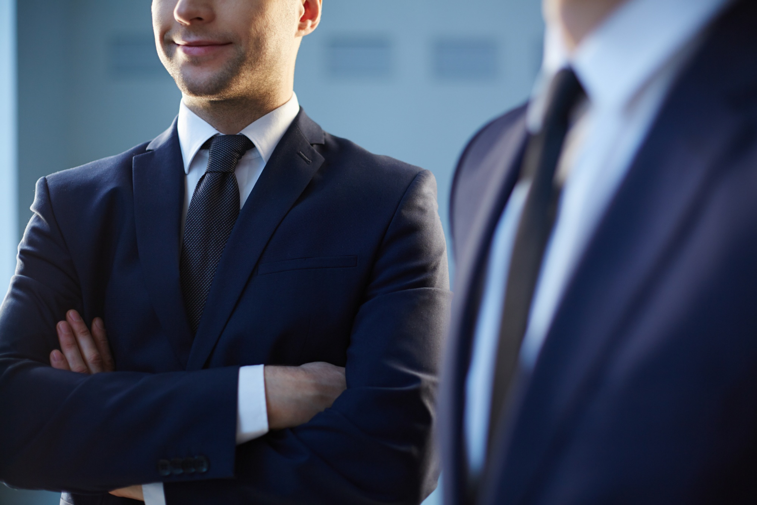 Two men in elegant suits | Source: Freepik