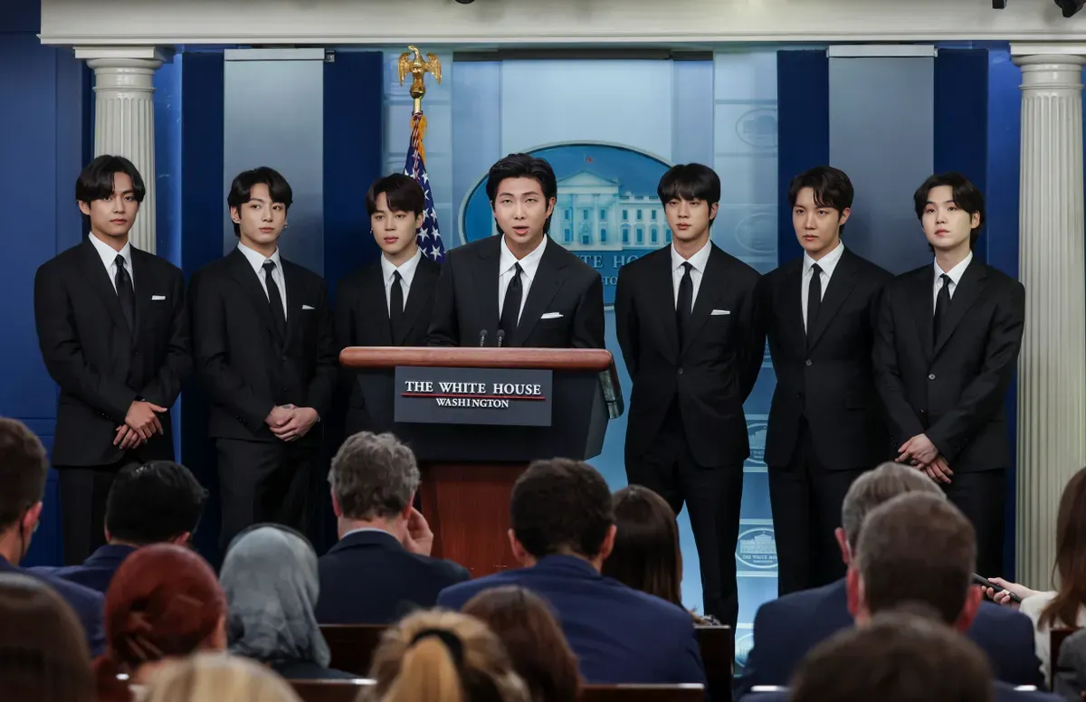 V, Jungkook, Jimin, RM, Jin, J-Hope and Suga of the South Korean pop group BTS speak at the daily press briefing at the White House on May 31, 2022 in Washington, DC. | Source: Getty Images