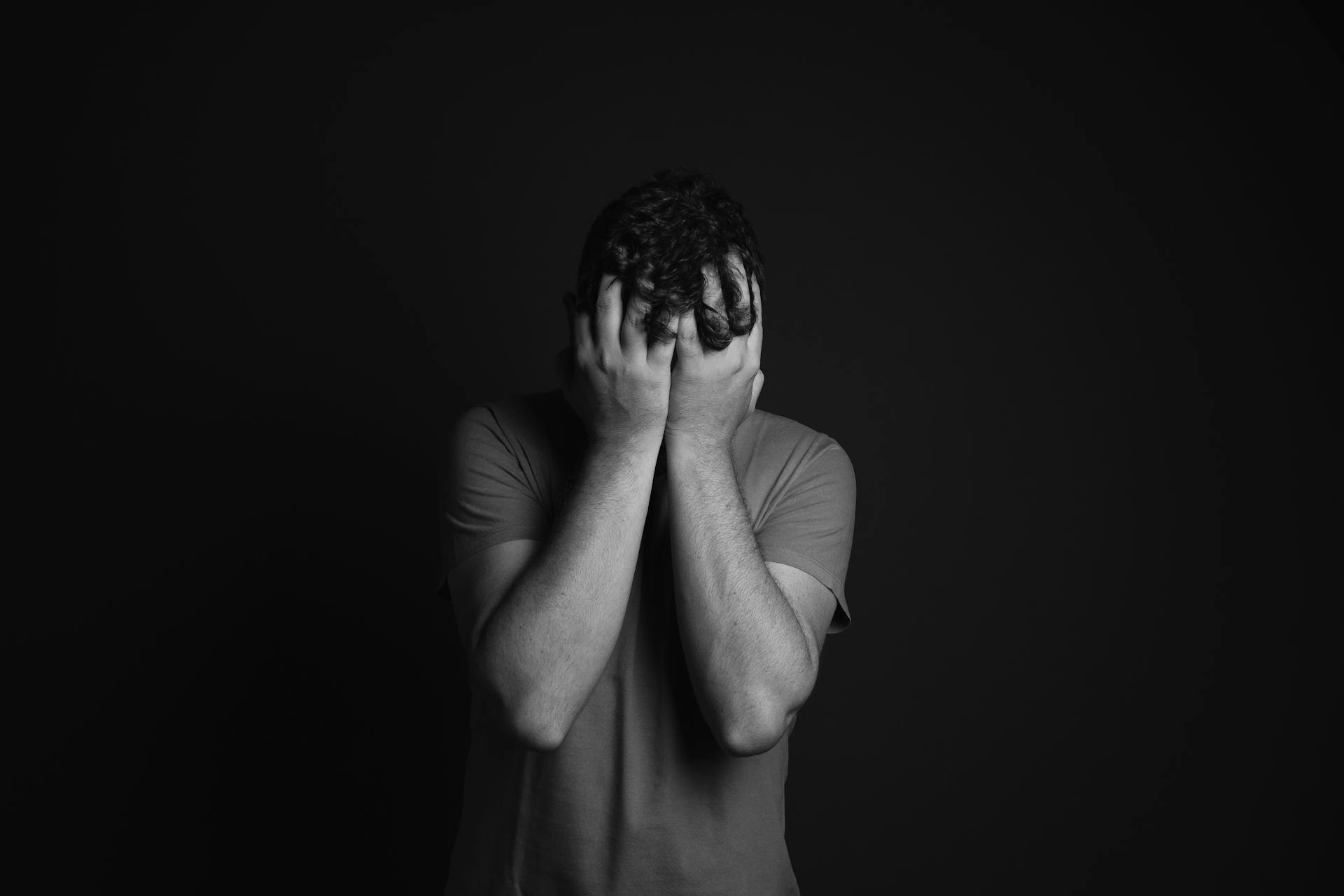 Grayscale shot of a frustrated man | Source: Pexels