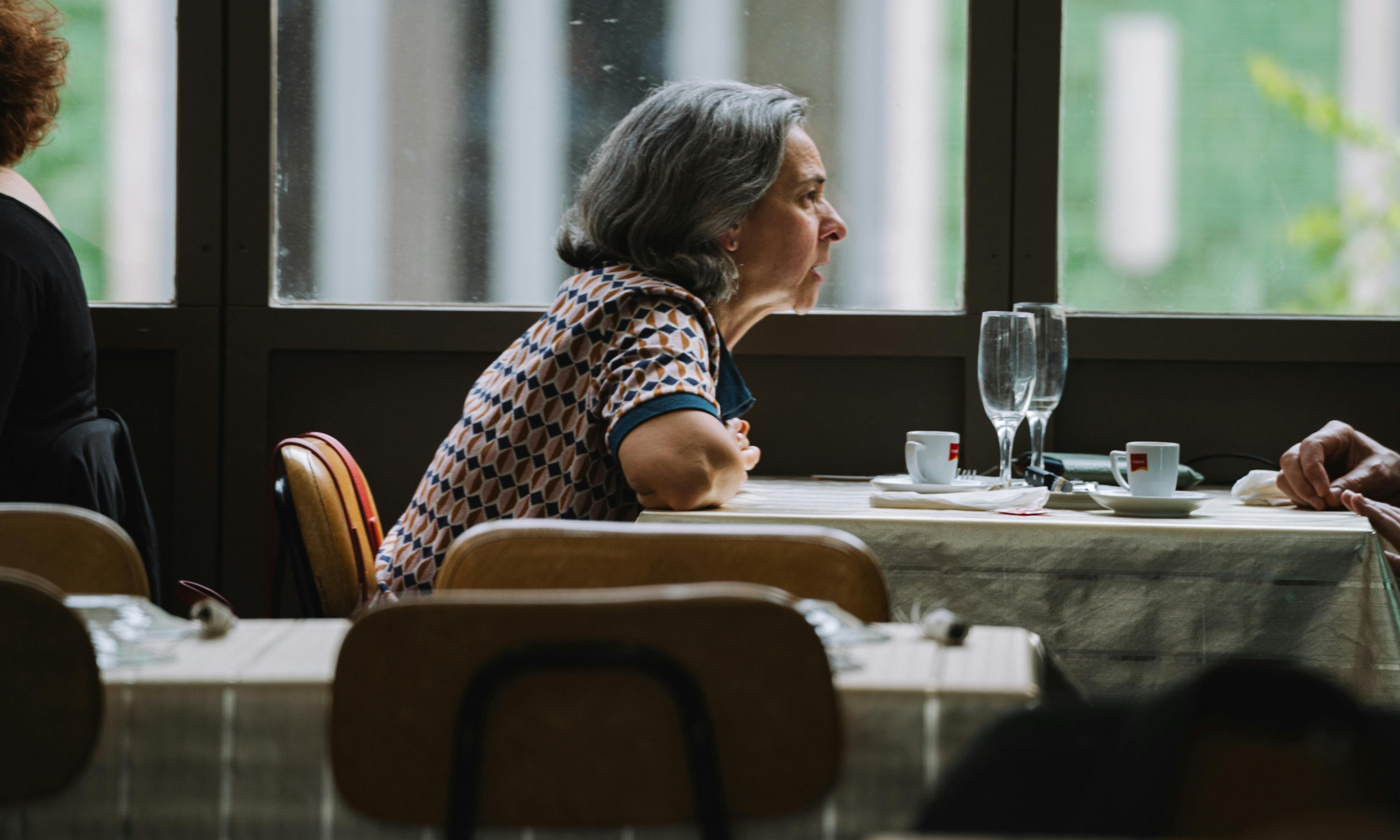 A restaurant diner talking to an unseen companion | Source: Pexels