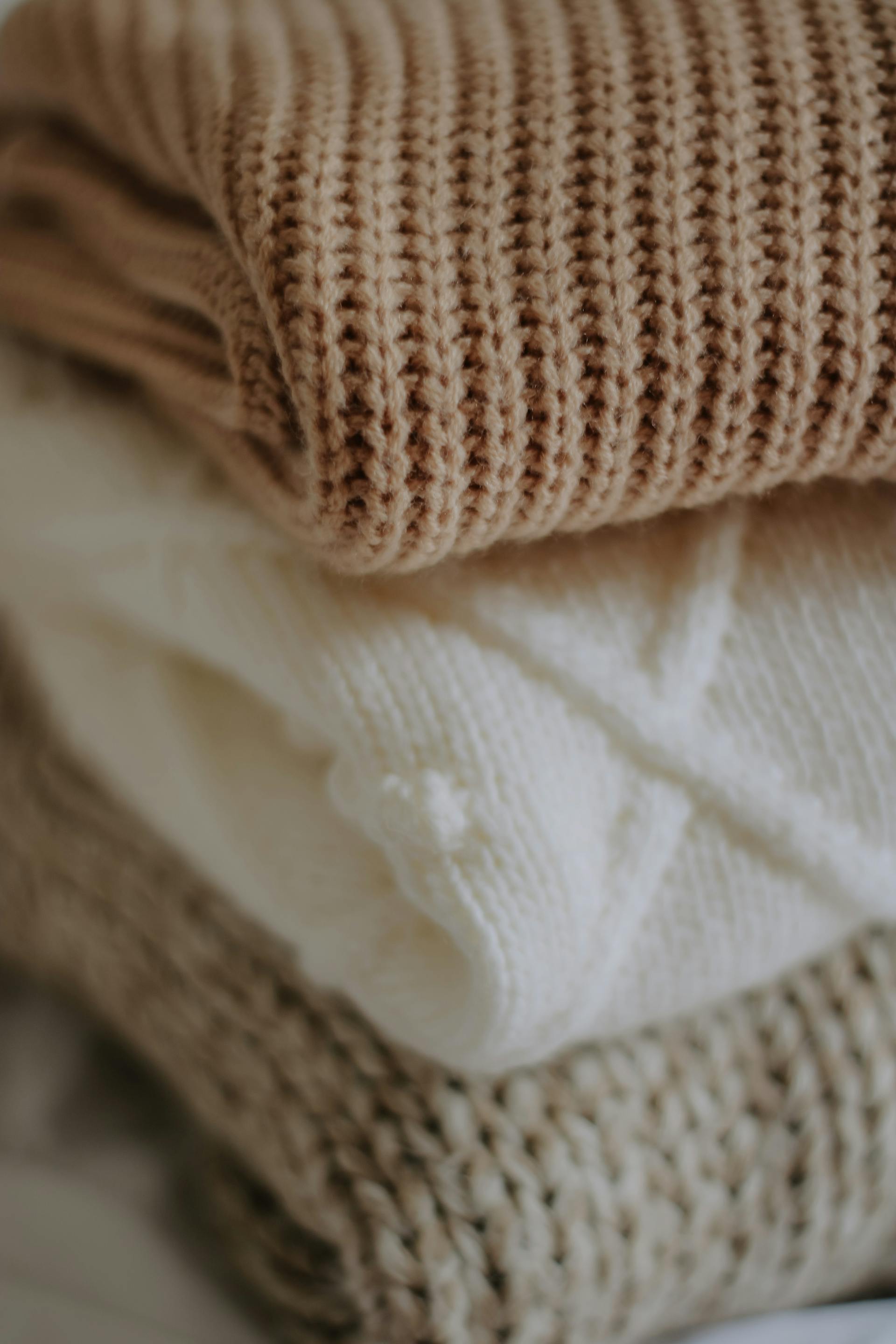 A close-up shot of folded knitted clothes | Source: Pexels