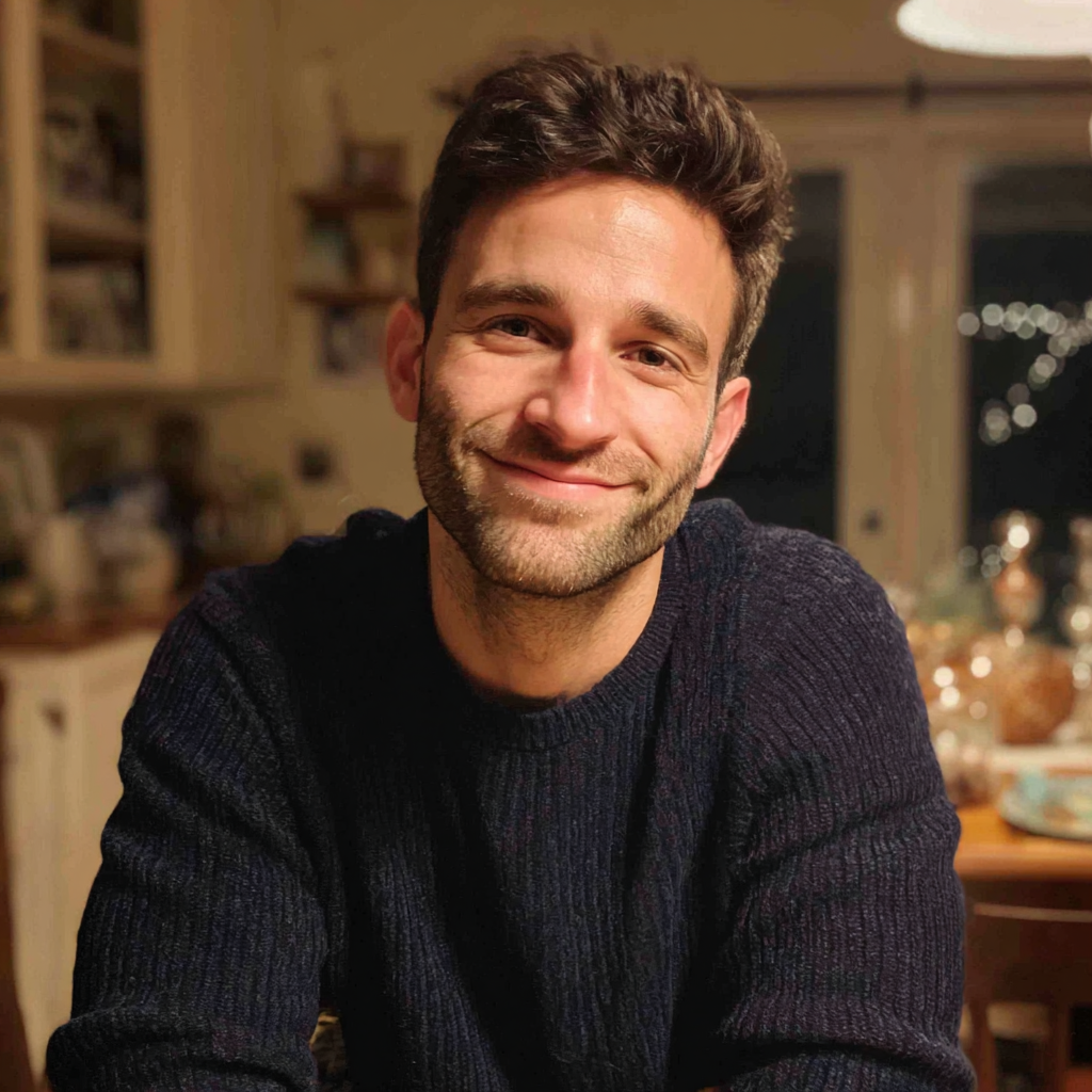A man sitting at a table wearing a navy sweater | Source: Midjourney