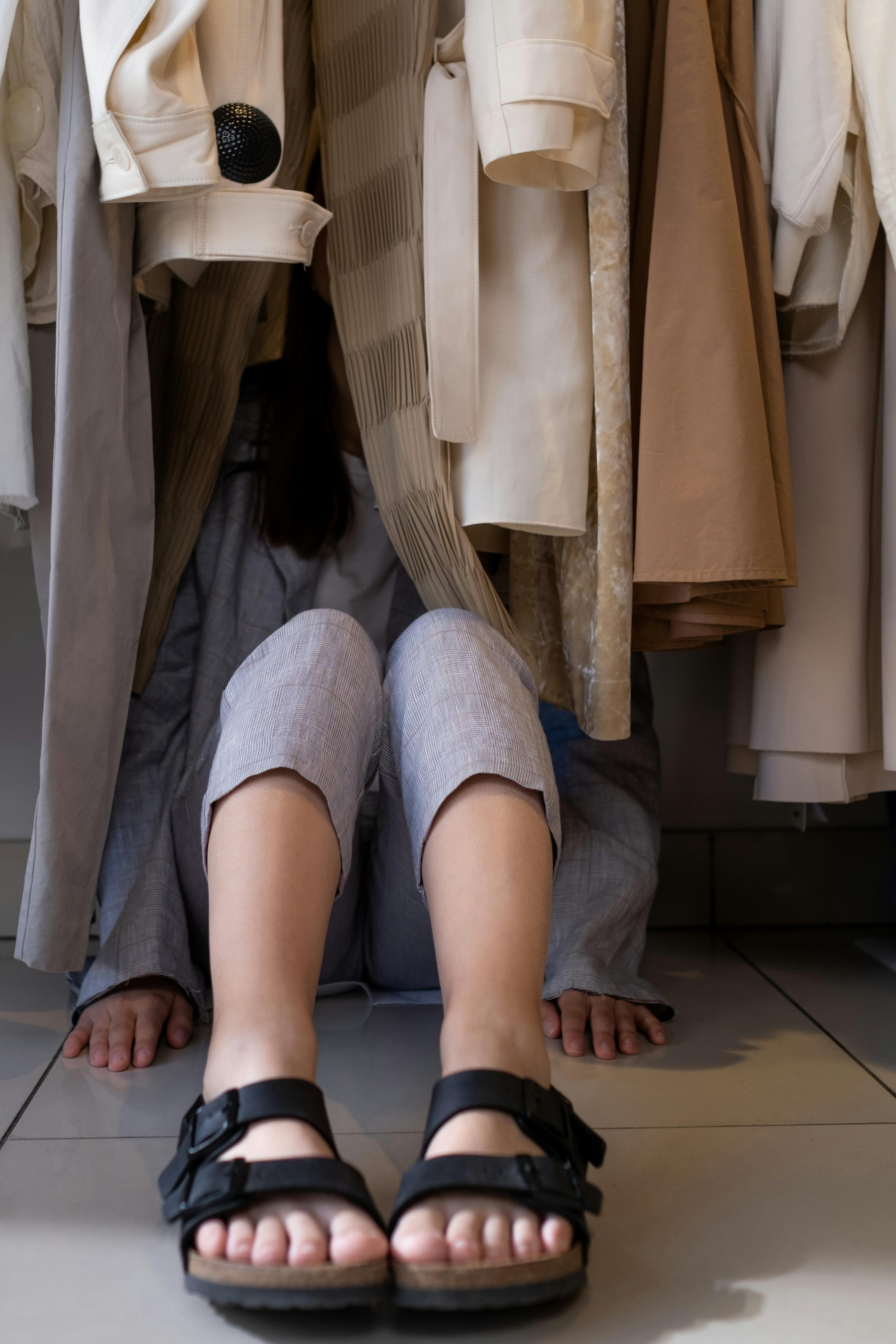 A woman hiding in a closet | Source: Pexels