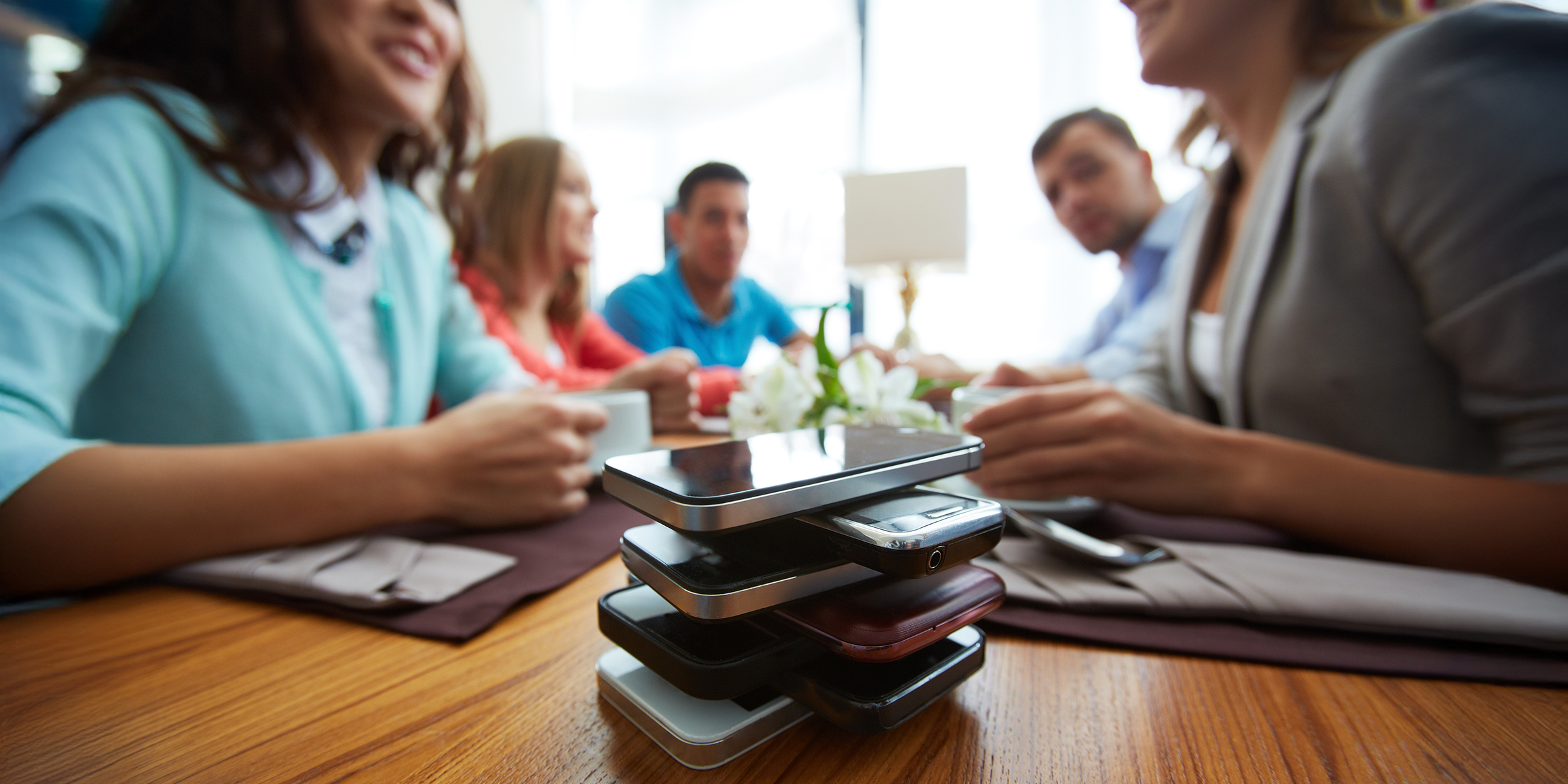 A stack of phones on a table | Source: Shutterstock