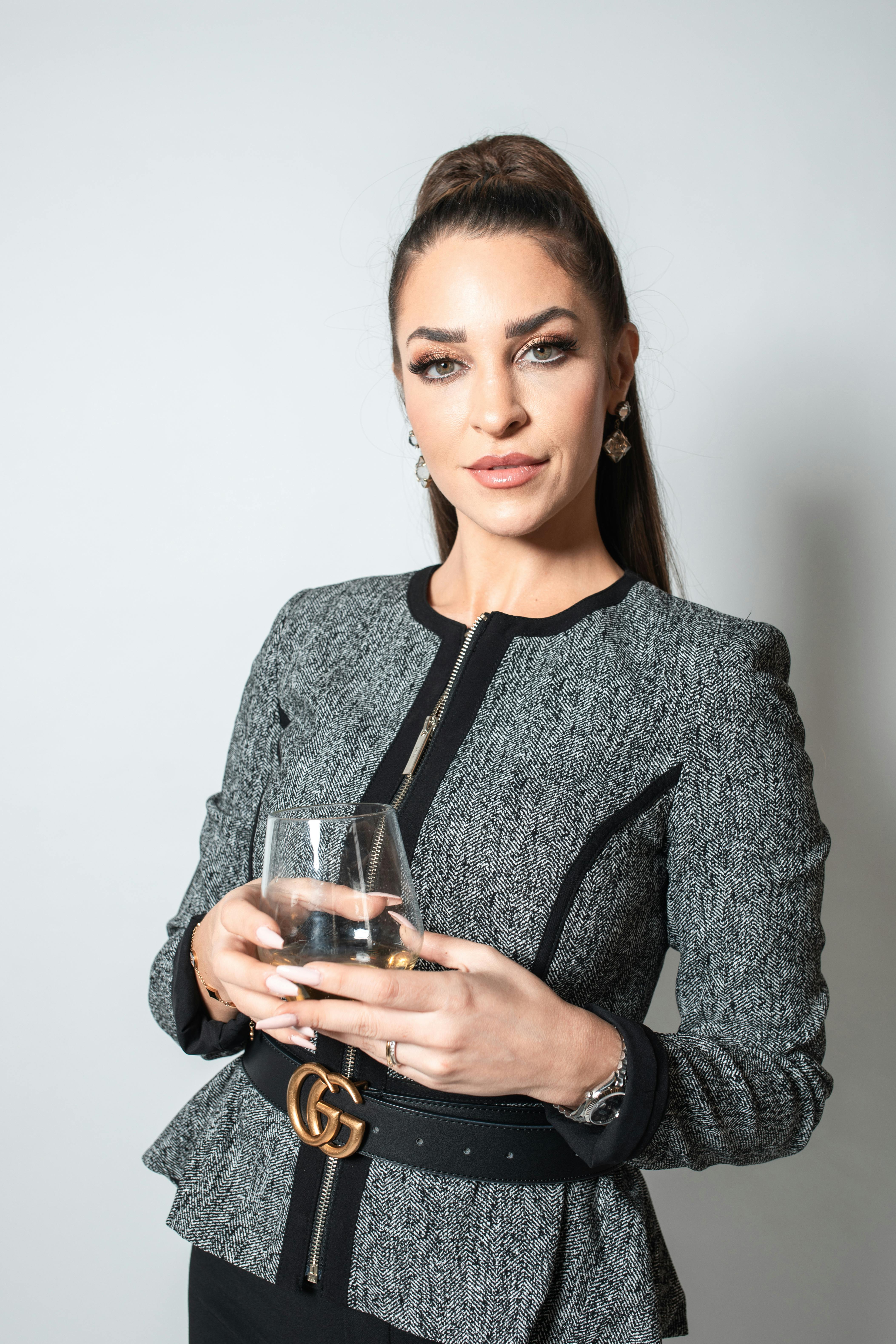 A formally dressed woman watching someone | Source: Pexels