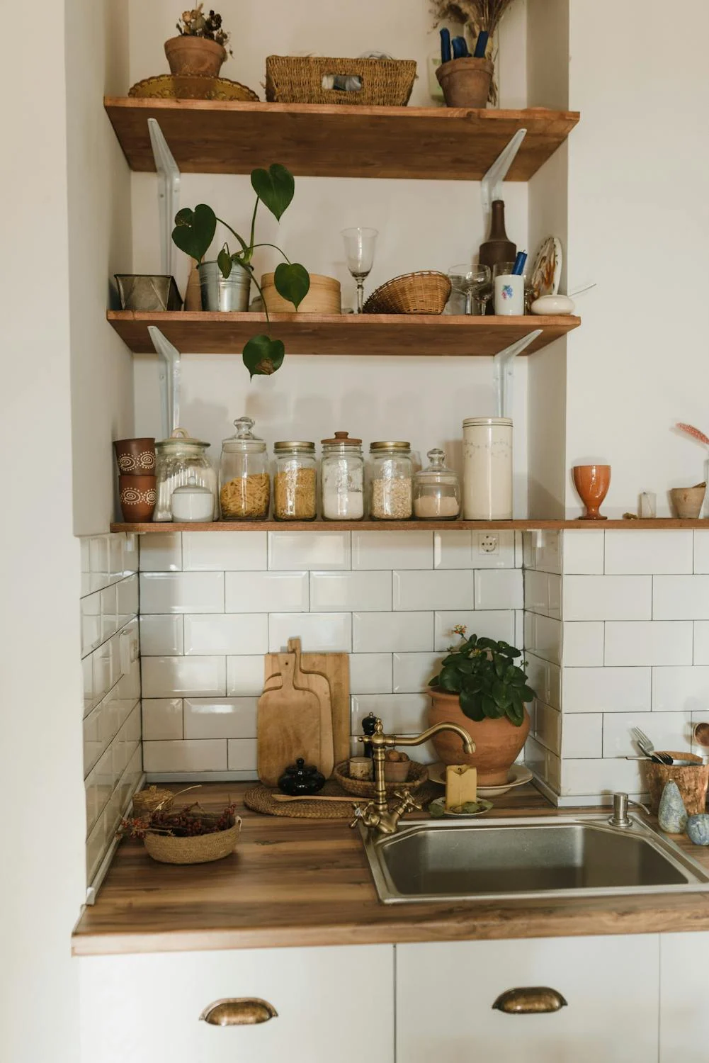 A sink with wooden shelves | Source: Pexels