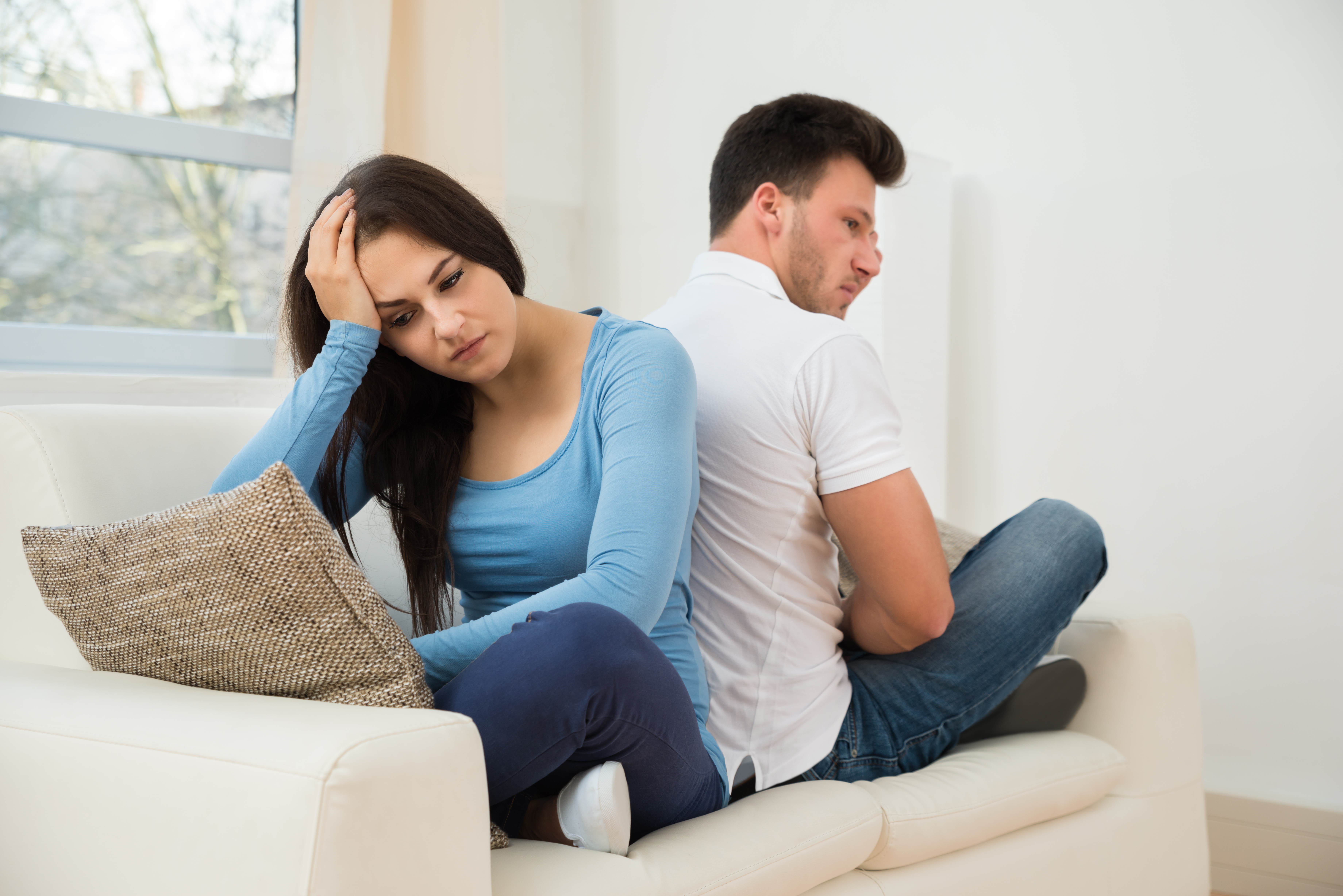 An upset couple not talking | Source: Shutterstock