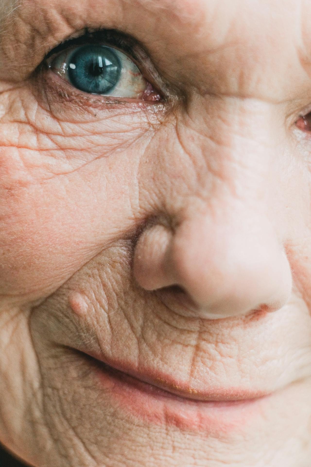 An emotionally overwhelmed older woman smiling | Source: Pexels